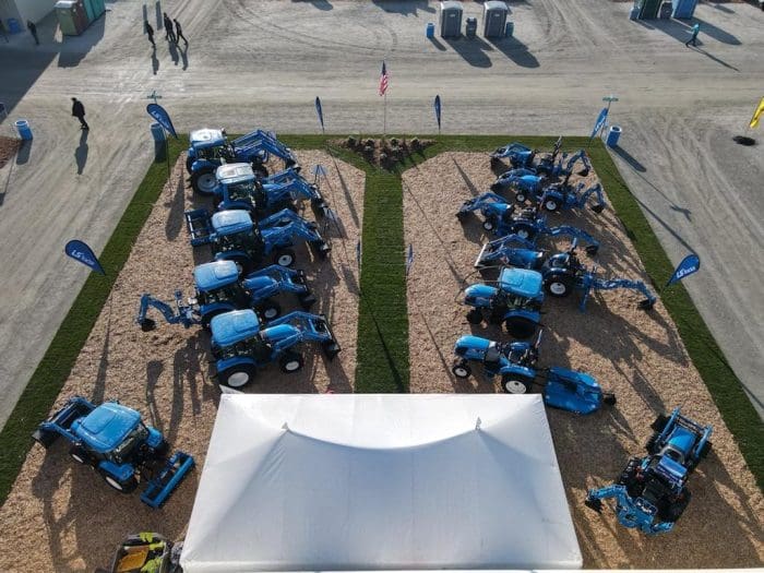 Drone view above tent and tractors